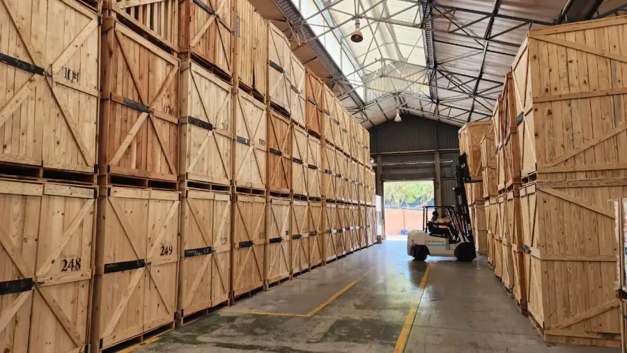 Numbered wooden storage pods stacked inside a Cape Storit warehouse